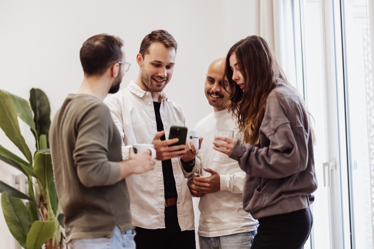 Community gathering — people connecting over ideas